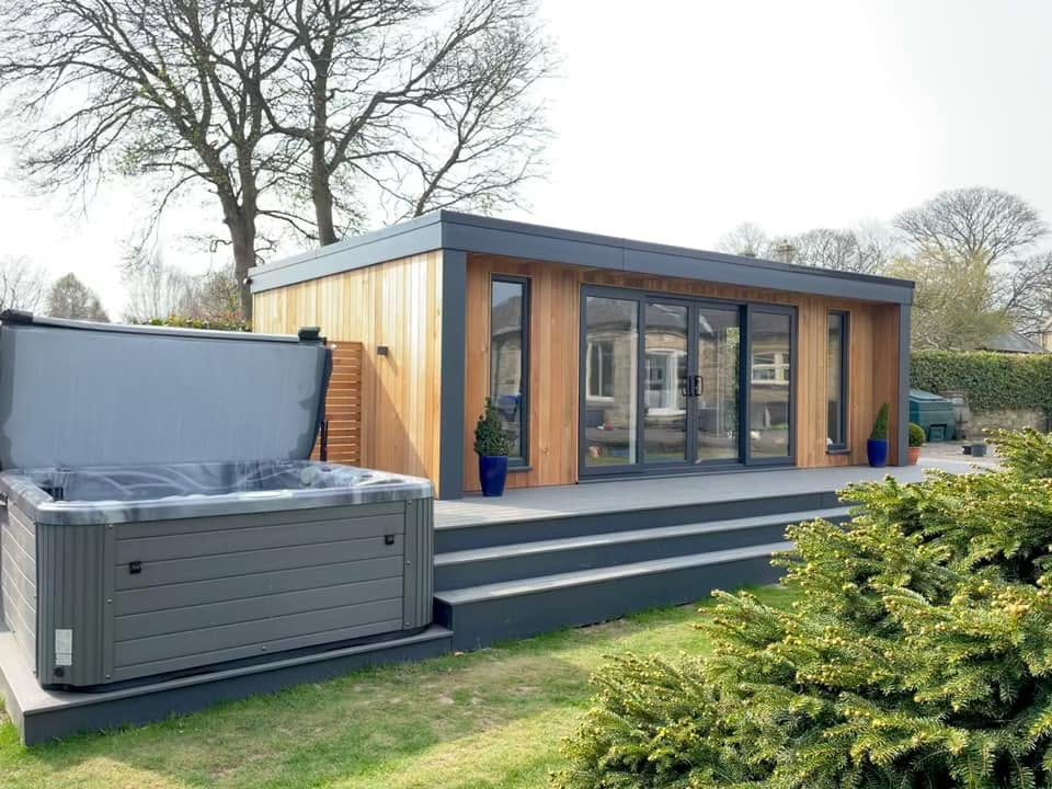 Luxury hot tub installed alongside a bespoke garden room on composite decking